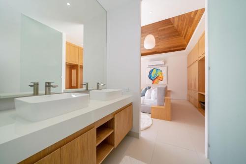 a bathroom with a sink and a mirror at Exclusive New Build - Designer 3BR Pool Villa in Prestigious LuxPride 4 L7 Residence in Bang Tao Beach