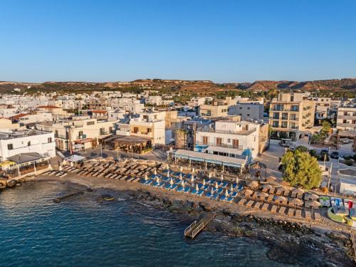 an aerial view of a beach with chairs and buildings at Cabana Blu Lifestyle Boutique Hotel & Suites in Kardamaina