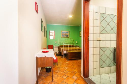a room with a table and a bed in a room at Villa Felice in Giardini Naxos