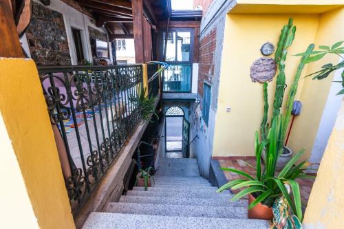 a staircase leading up to a building with plants at Villa Felice in Giardini Naxos