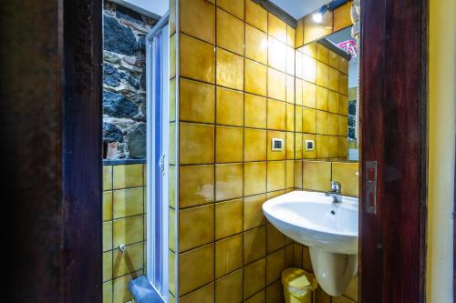 a bathroom with a sink and a mirror at Villa Felice in Giardini Naxos