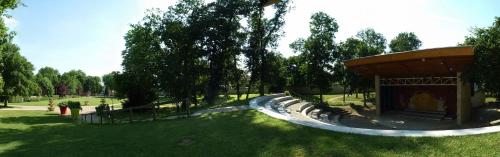 a park with a slide in the grass at Studio 2 - 3 minutes du Futuroscope in Chasseneuil-du-Poitou
