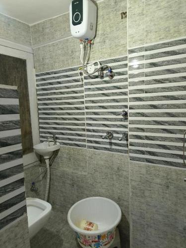 a bathroom with a toilet and a sink at TEJAS HOMESTAY JUST 2 MINUTES from GOLDEN TEMPLE in Amritsar