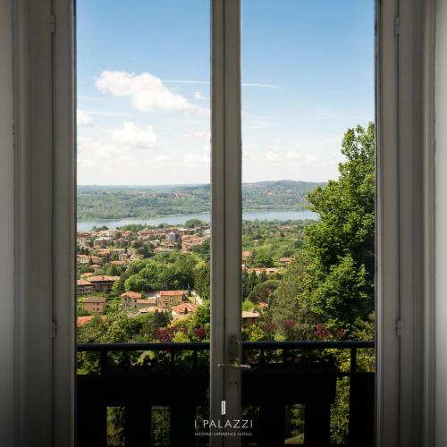 a window with a view of a city at Palace Grand Hotel Varese in Varese