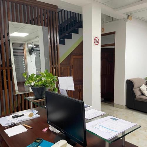 an office with a desk with a computer on it at Ryan Residence & Restaurant in Negombo