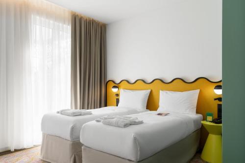 Postel nebo postele na pokoji v ubytování ibis Styles Old Tbilisi