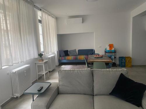 a living room with a couch and a table at Loft 33 in Milan
