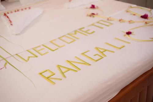 a white cake with the words anniversaryiversary on it at Rangali thoddoo Maldives in Thoddoo