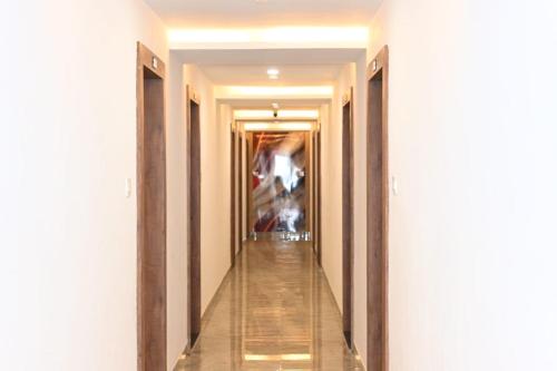 a hallway of a building with a long corridor at MadStays The Chandigarh House, Bhopal in Bhopal