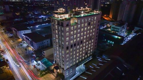 an overhead view of a tall building at night at The Skye Phnom Penh Hotel & Apartments in Phnom Penh