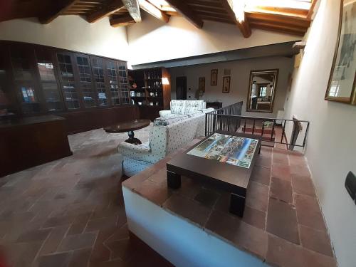 a lobby with couches and a table in a building at Podere Cerciano in Radicondoli