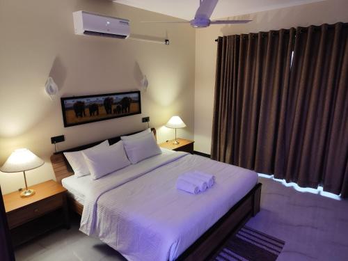 Postel nebo postele na pokoji v ubytování Villa Infinity Negombo