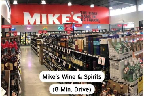 a store filled with bottles of wine and spirits at Classy 2BR-Parking, Rooftop,Near Arrowhd & TMobile in Kansas City