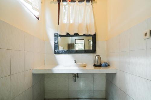 Koupelna v ubytování Bismajaya Bungalow