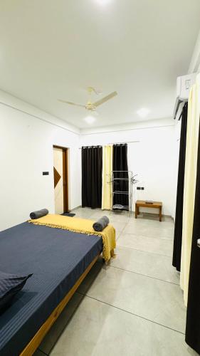 a bedroom with a large bed in a room at Coastal Bliss Appartments in Varkala