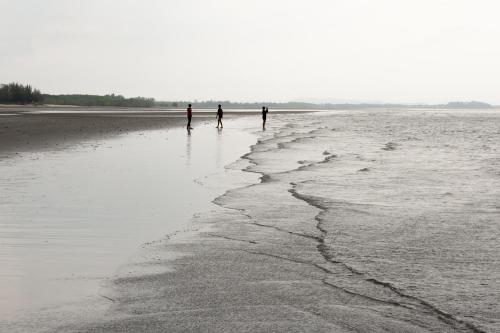 three people standing on a beach near the water at Camp Cayla - COASTA in Ban Ao Makham Pom