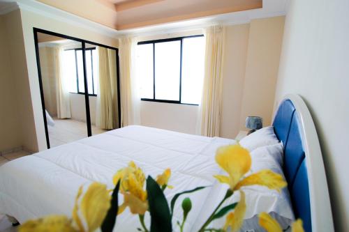 Postel nebo postele na pokoji v ubytování Blue Bay Hotel