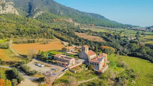 an aerial view of a house on a hill at Els Majordoms - El Mont in Beuda
