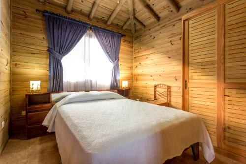 Giường trong phòng chung tại Casa Marcellino Lodge