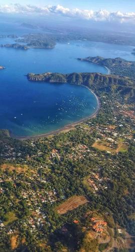 an aerial view of a city and a body of water at Casa Rosa Del Mar in Coco