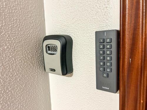 a remote control is attached to a wall at Santanalodge - Piso a pocos metros de la playa in Pontevedra
