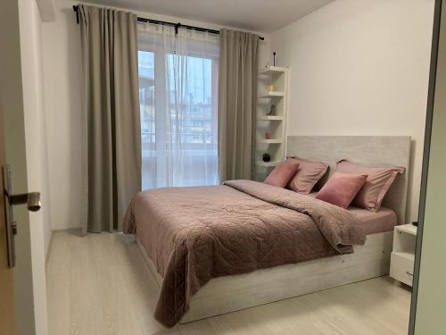 Katil atau katil-katil dalam bilik di Delux 2 - Plovdiv Модерен апартамент до Стария град и Източната порта