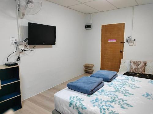 Ένα ή περισσότερα κρεβάτια σε δωμάτιο στο Sweet Rooms WATCHARAPHOL