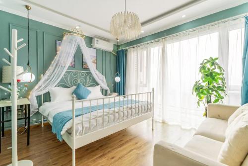 Postel nebo postele na pokoji v ubytování Jinxin-Tianlun Garden