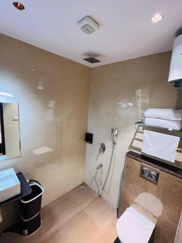 a bathroom with a shower and a sink at Shubh Laxmi Residence in Ajmer