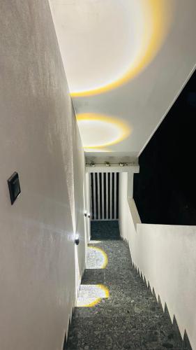 a hallway with a white wall and a ceiling at Villa J Ambalangoda in Ambalangoda