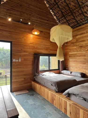 Postel nebo postele na pokoji v ubytování Hi Bungalow
