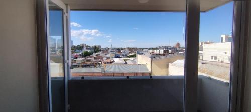 Balkón nebo terasa v ubytování departamento céntrico amplio y cómodo