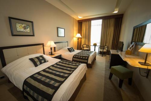 Katil atau katil-katil dalam bilik di Century Park Hotel
