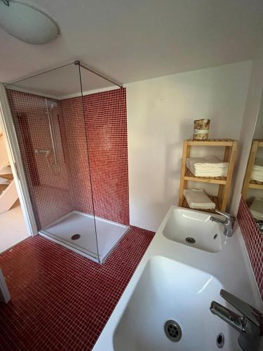 a bathroom with a sink and a glass shower at Holiday home with alpine panorama in Teolo