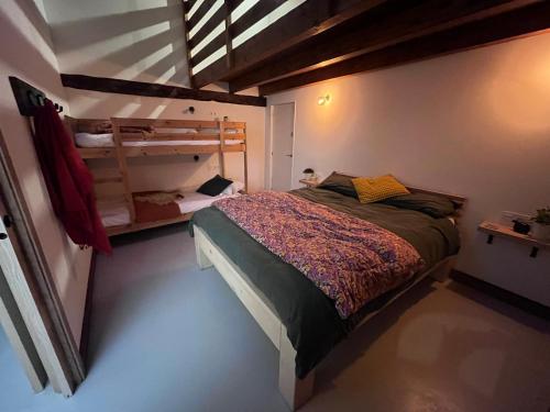 a bedroom with a bed and a bunk bed at Olabe in Ea