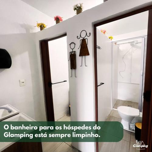 a bathroom with a shower and a sink at Glamping Pomerode in Pomerode