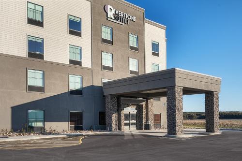 a rendering of the entrance to a hotel at Riverstone Suites by Cobblestone Hotels - Chippewa Falls in Chippewa Falls