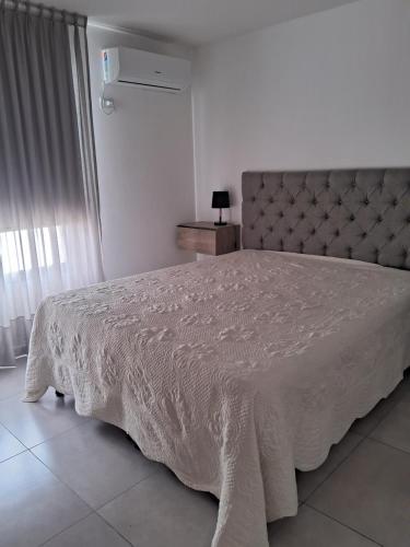 Ένα ή περισσότερα κρεβάτια σε δωμάτιο στο Paseo quattro