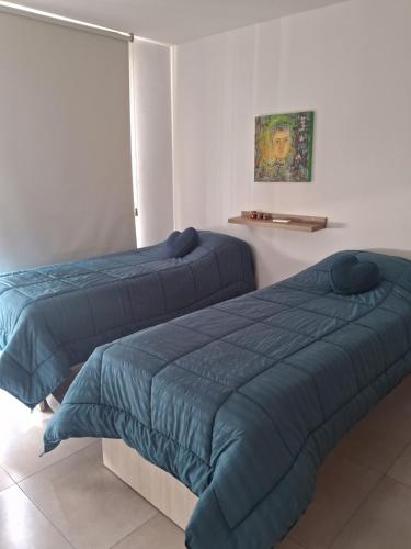 Ένα ή περισσότερα κρεβάτια σε δωμάτιο στο Paseo quattro