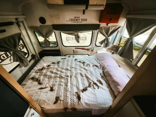 a bed in the back of a camper van at Trasimeno Glamping Resort in Magione
