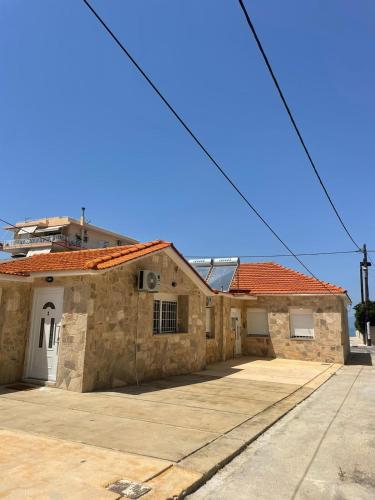 a large stone building with a driveway at Lemon tree Gr in Xylokastron
