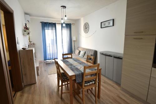 a kitchen and dining room with a table and chairs at Sea Breeze Nest in St Paul's Bay