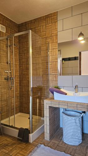 a bathroom with a shower and a sink at Miodówka in Stronie Śląskie