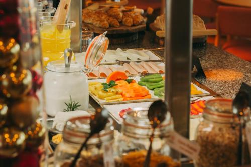 a buffet with many different types of food at Estrela Serenity - Resort in Folgosinho