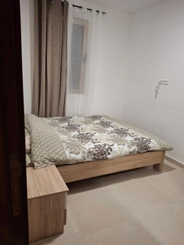 Ένα ή περισσότερα κρεβάτια σε δωμάτιο στο Tims apartment