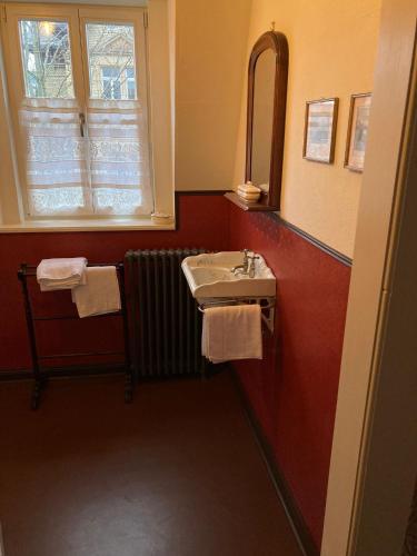 a bathroom with a sink and a window at Villa Hartmann B&B in Bad Kreuznach