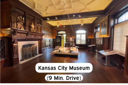 a large room with a fireplace and a living room at Chic 1BR Parking, Rooftop, Near Arrowhd & TMobile in Kansas City