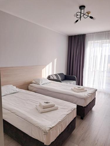 Cama o camas de una habitación en Sympo Apartments