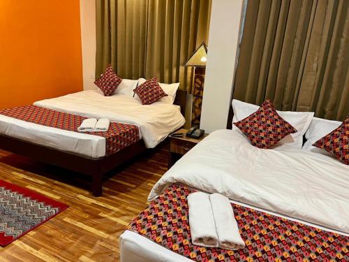 Cama o camas de una habitación en Gorkha Heritage Home