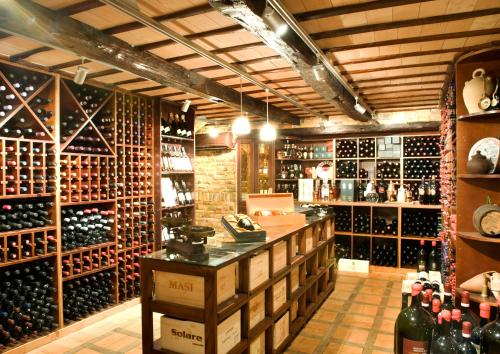 a wine cellar with a lot of wine bottles at Hotel Cala Del Porto in Vibo Valentia Marina
